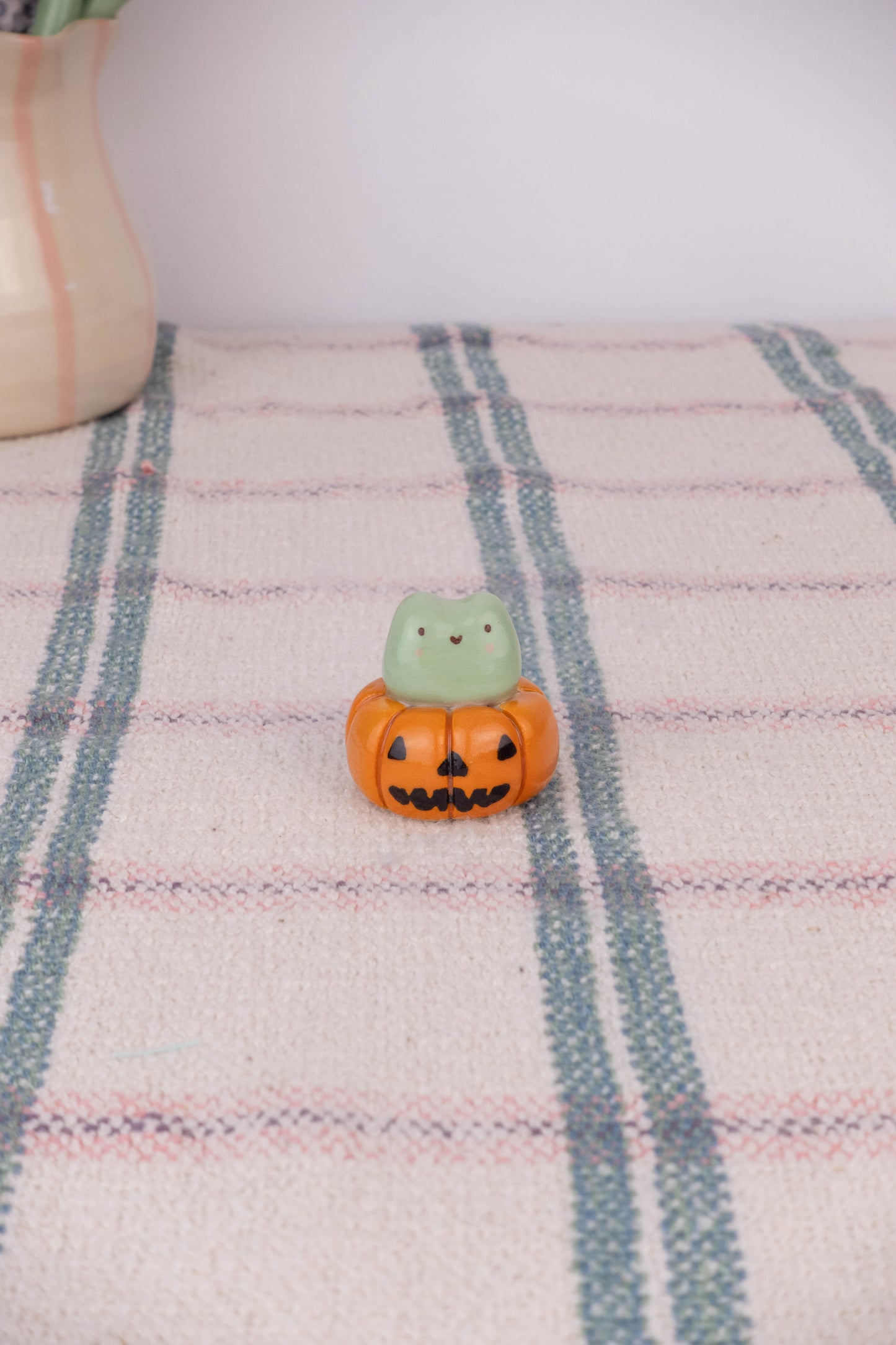 Tiny Frog on a Pumpkin